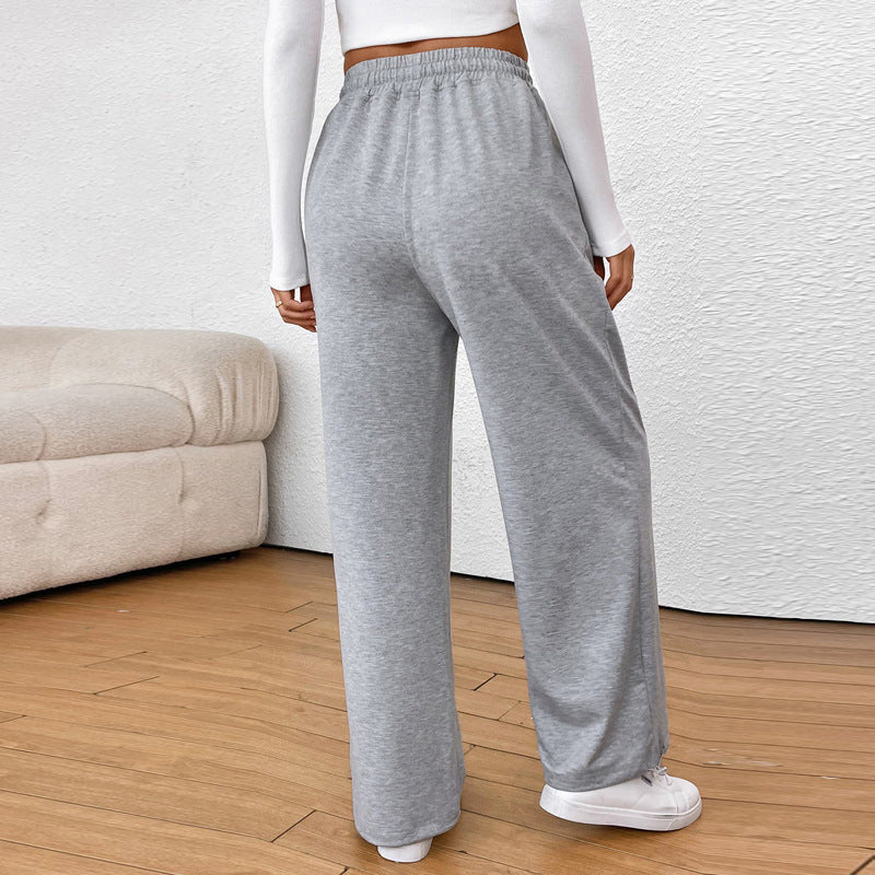 Women's wide sweatpants with elastic waistband, drawstring and adjustable hem.