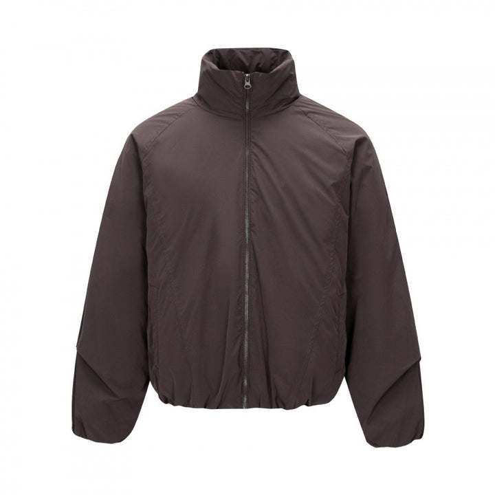 Unisex Short cut lightweight windbreaker in boxy cut with high stand-up collar and elastic hem Mune Fashion