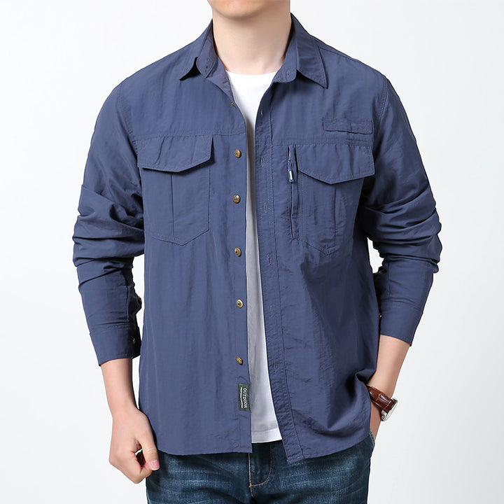 Men's long-sleeved field shirt made of lightweight ripstop with multifunctional chest pockets and concealed zip.
