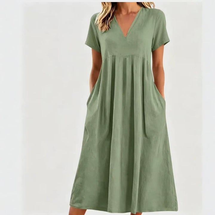 Women nan legeres V-neck midi dress with side pockets and gathered empire seam Mune Fashion