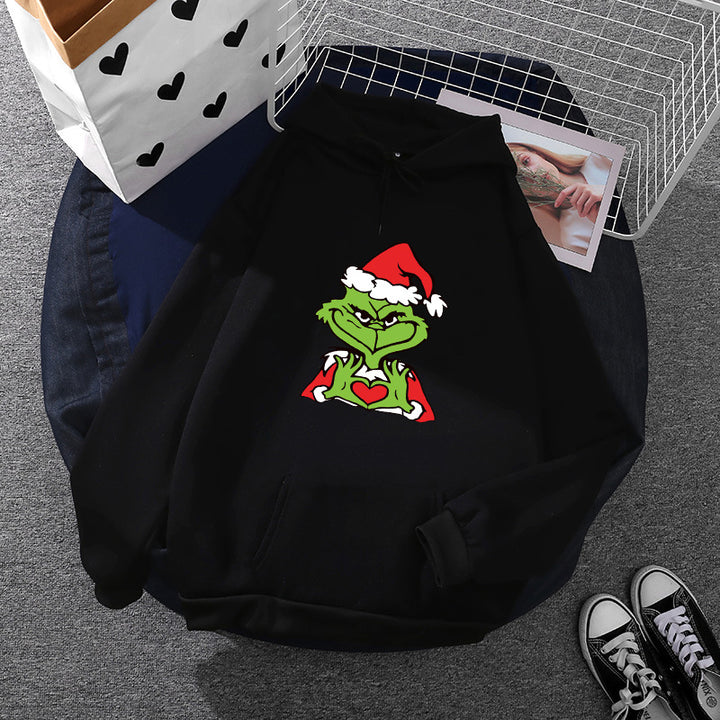 Unisex hoodie with soft fleece lining, kangaroo pocket and eye-catching Christmas comic print Mune Fashion