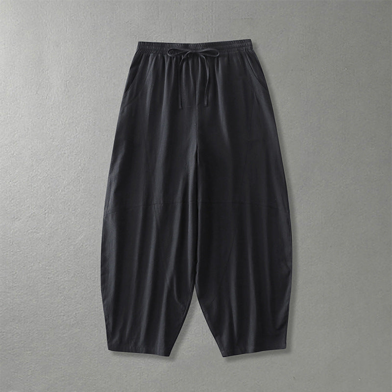 Women's wide harem pants made of lightweight satin with drawstring and side pockets Mune Fashion