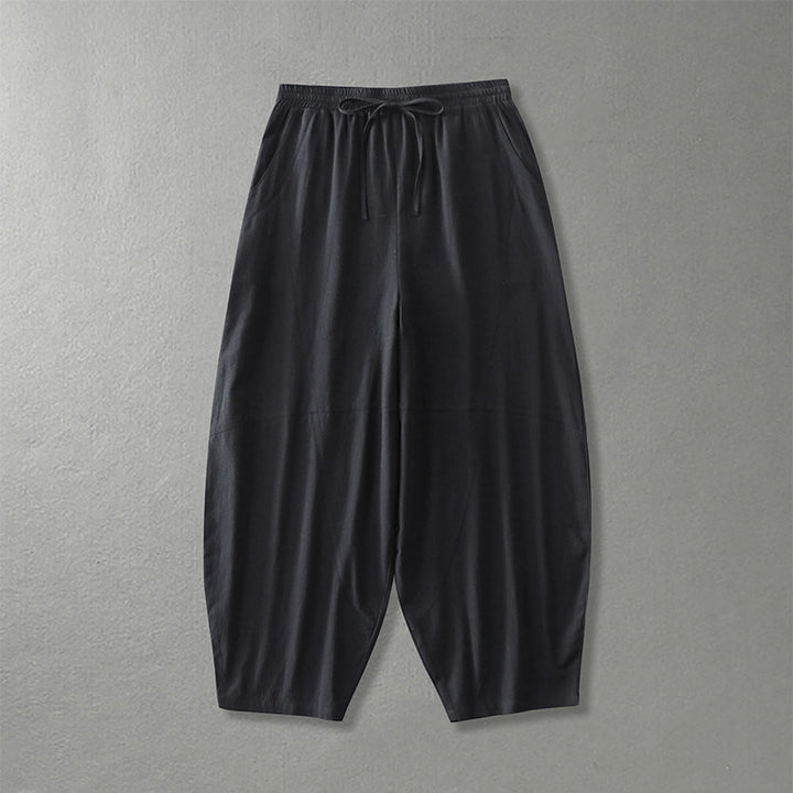 Women's wide harem pants made of lightweight satin with drawstring and side pockets Mune Fashion