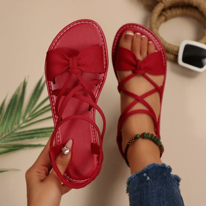 Damen Zarte Römersandalen mit Schleifen-Detail und verstellbaren Schnürriemen Mune Fashion