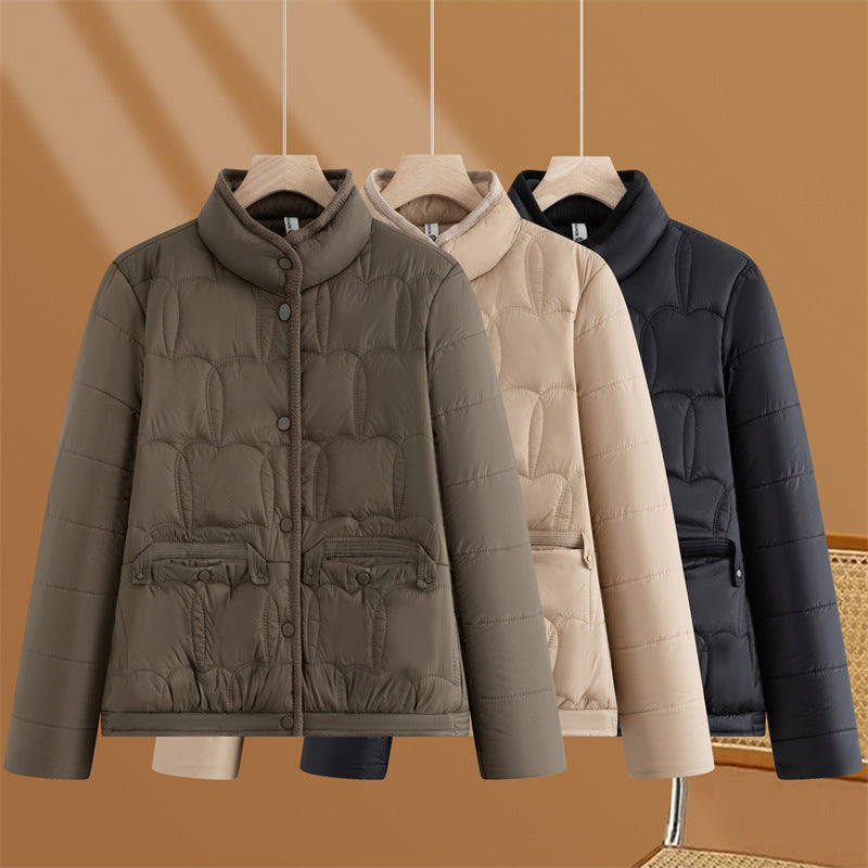 Women's short quilted transitional jacket with stand-up collar and flap pockets Mune Fashion