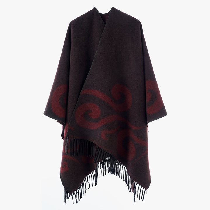 Women's wool blend poncho with jacquard swirl pattern, V-neck and fringes