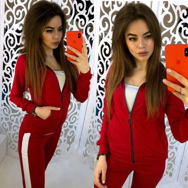Women's tracksuit made of stretch material with side contrast stripe and zipper Mune Fashion