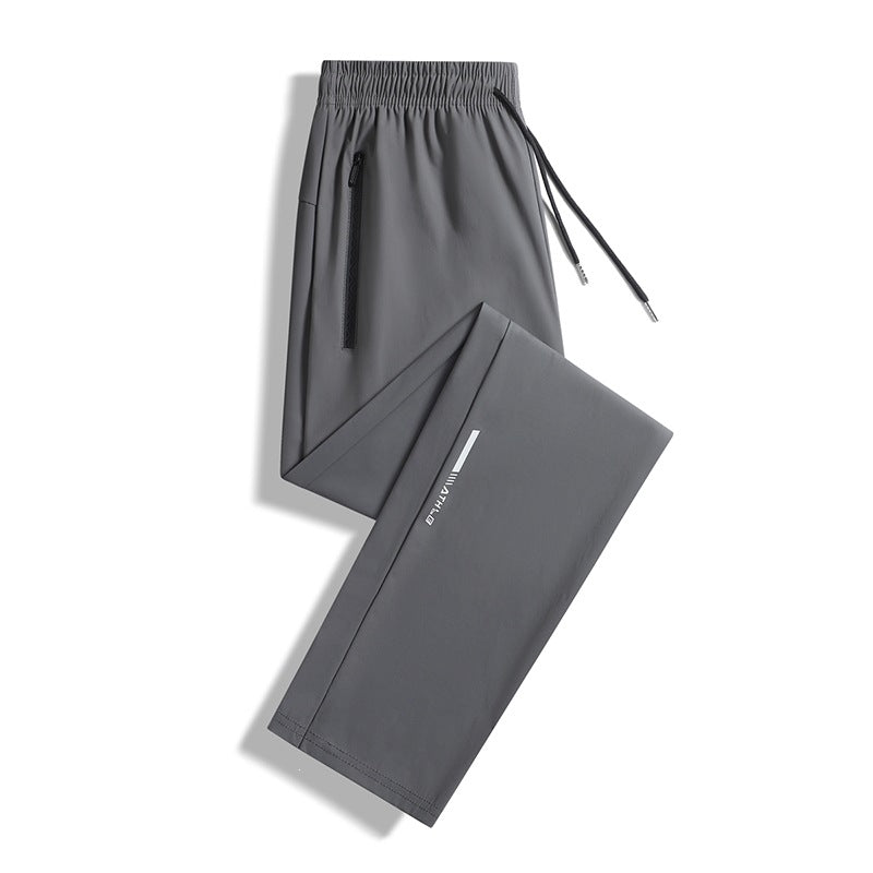 Men's sporty jogging pants with elastic waistband and practical zip pockets Mune Fashion