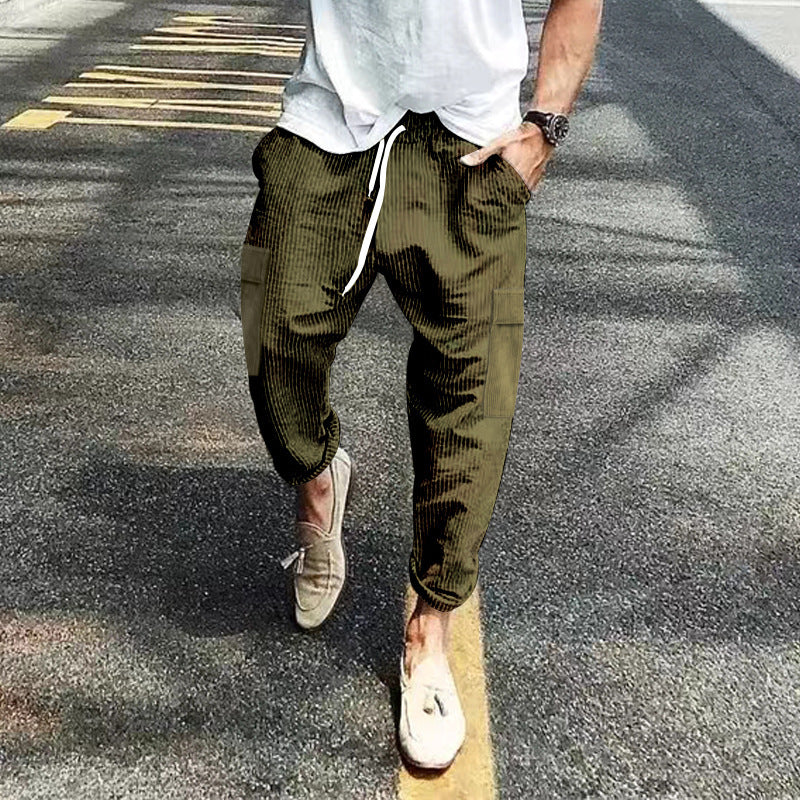 Men's corduroy cargo jogging pants with elastic drawstring waistband, flap pockets, and tapered leg Mune Fashion