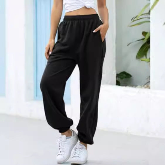 Women's wide High-Waist jogging pants made of soft fleece with elastic waistband, side pockets, and narrow cuffs Mune Fashion