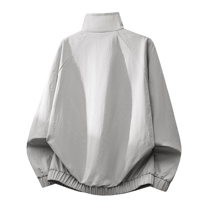Men's ultra-lightweight windbreaker jacket with stand-up collar, elastic hem, and concealed snap button pockets Mune Fashion