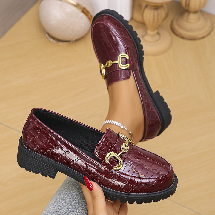 Women's loafers with glossy crocodile embossing, featuring a profiled tractor sole and golden decorative buckle Mune Fashion