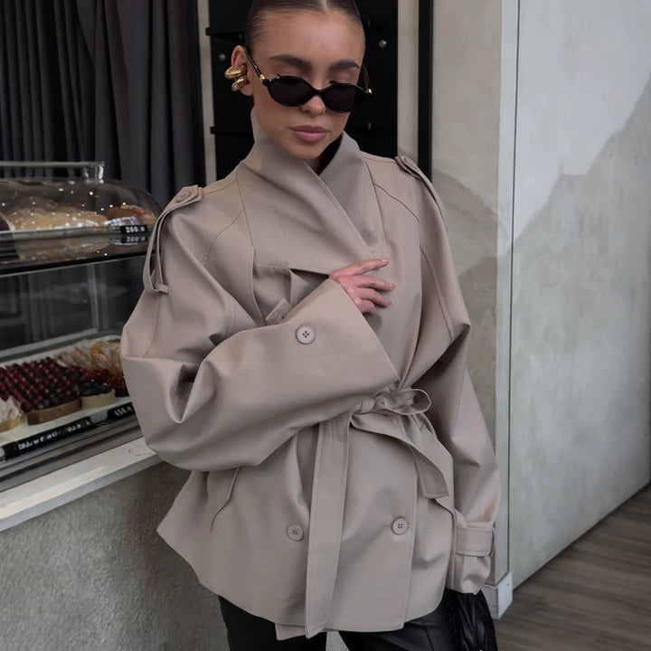 Women's short trench coat with wide standing collar, shoulder epaulettes, and waist belt Mune Fashion