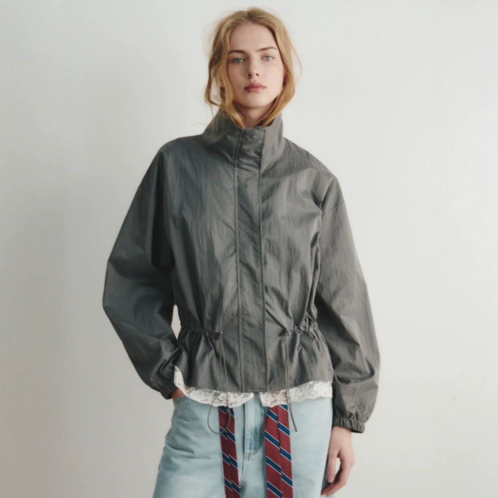 Women's oversized windbreaker with high stand-up collar, drawstring waist, and elastic cuffs