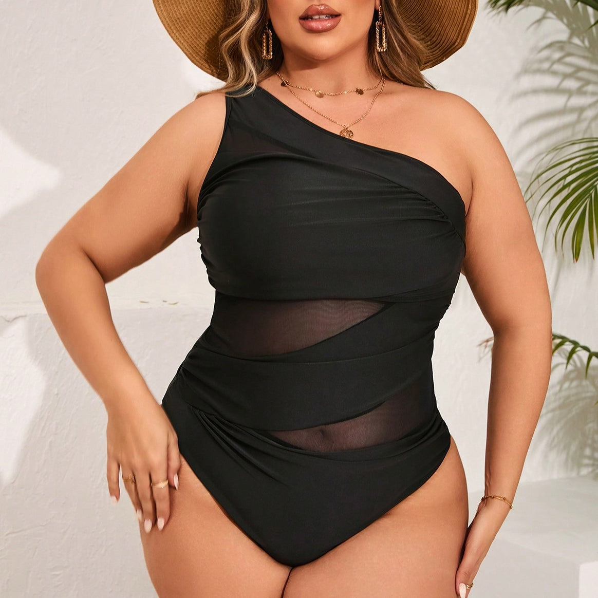 Women's one-piece swimsuit with asymmetrical cut and transparent ruffle details Mune Fashion