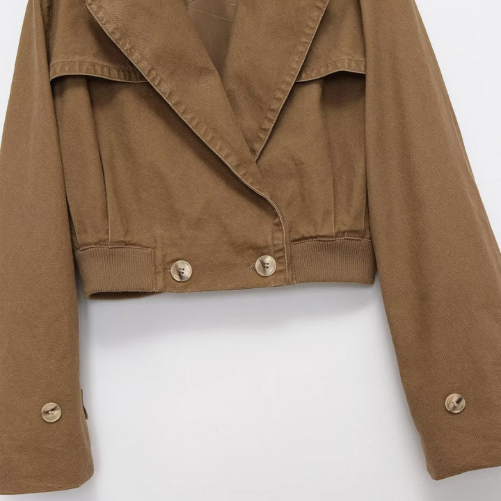 Women's Cropped Trench Blouson Jacket with double-breasted button placket, shoulder patches, and elastic hem Mune Fashion