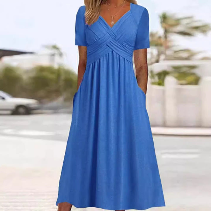 Women's airy midi dress with V-neck, wrap look, empire waist, and pockets Mune Fashion