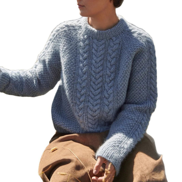 Women's oversized knitted sweater with cable pattern