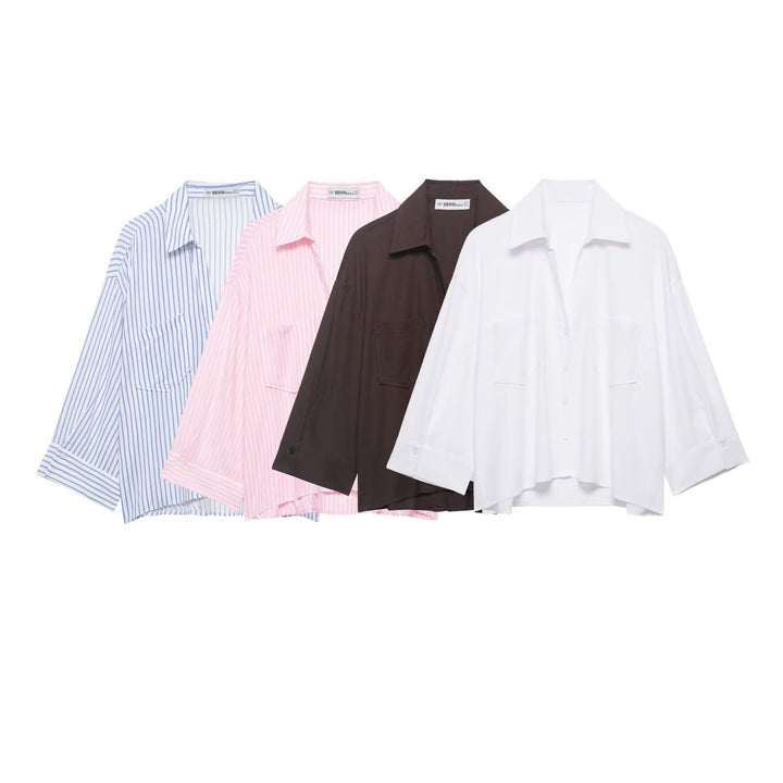 Women's oversized shirt blouse with fine striped pattern, chest pockets, and high-low hem Mune Fashion
