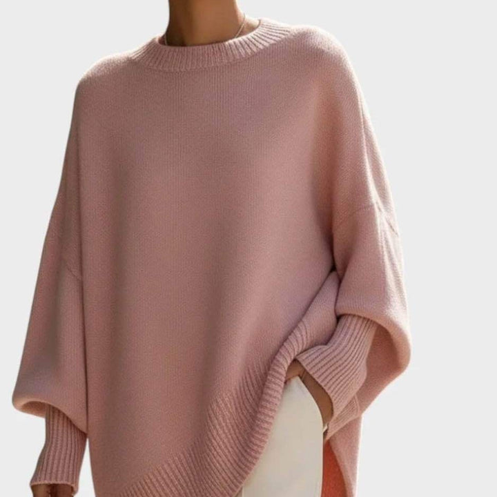 Women's oversized knit poncho with asymmetrical hem and ribbed sleeves Mune Fashion