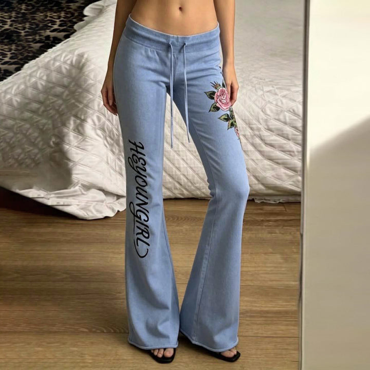 Women's casual jersey sweatpants with drawstring, floral side print, and statement lettering Mune Fashion