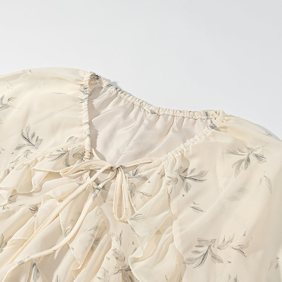 Women's maxi dress with ruffles, long bell sleeves, and floral chiffon design Mune Fashion