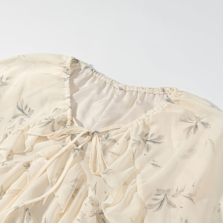 Women's maxi dress with ruffles, long bell sleeves, and floral chiffon design Mune Fashion