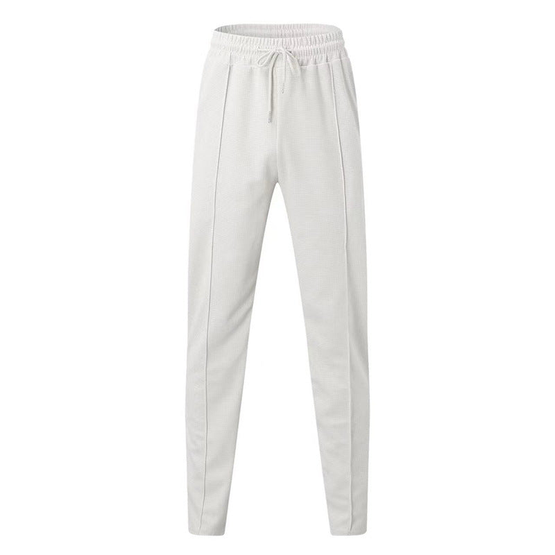 Men's patterned jogging pants with elastic drawstring, shaping crease, and tapered leg Mune Fashion