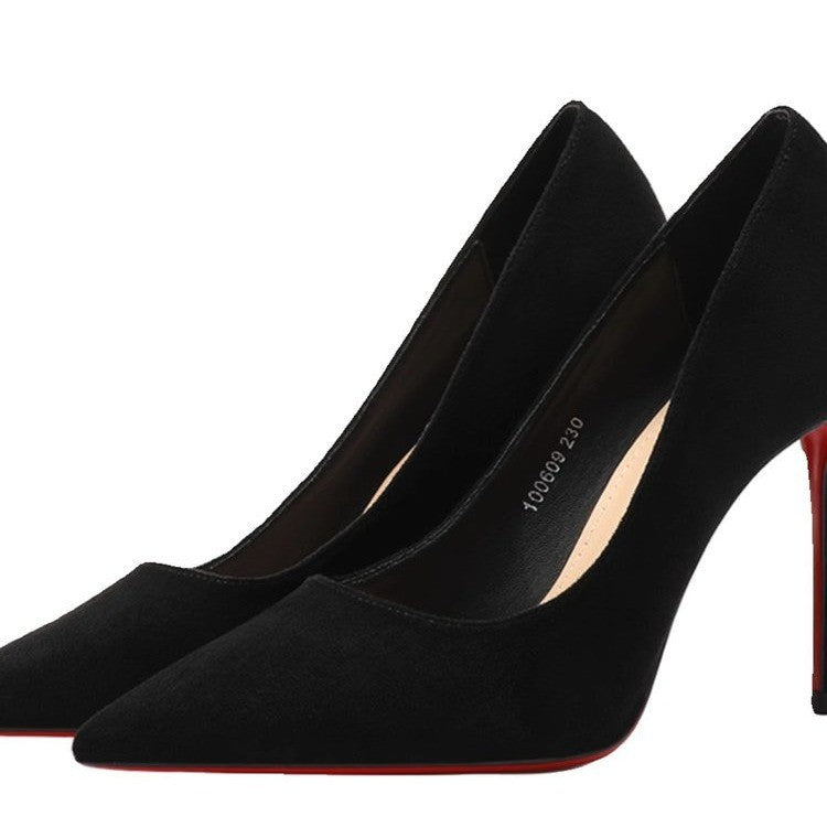 Ladies elegant pointed suede pumps with contrasting red sole and narrow stiletto heel