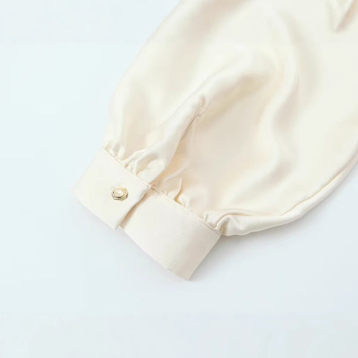 Women's satin blouse with deep wrap V-neck, elastic hem, and balloon sleeves Mune Fashion