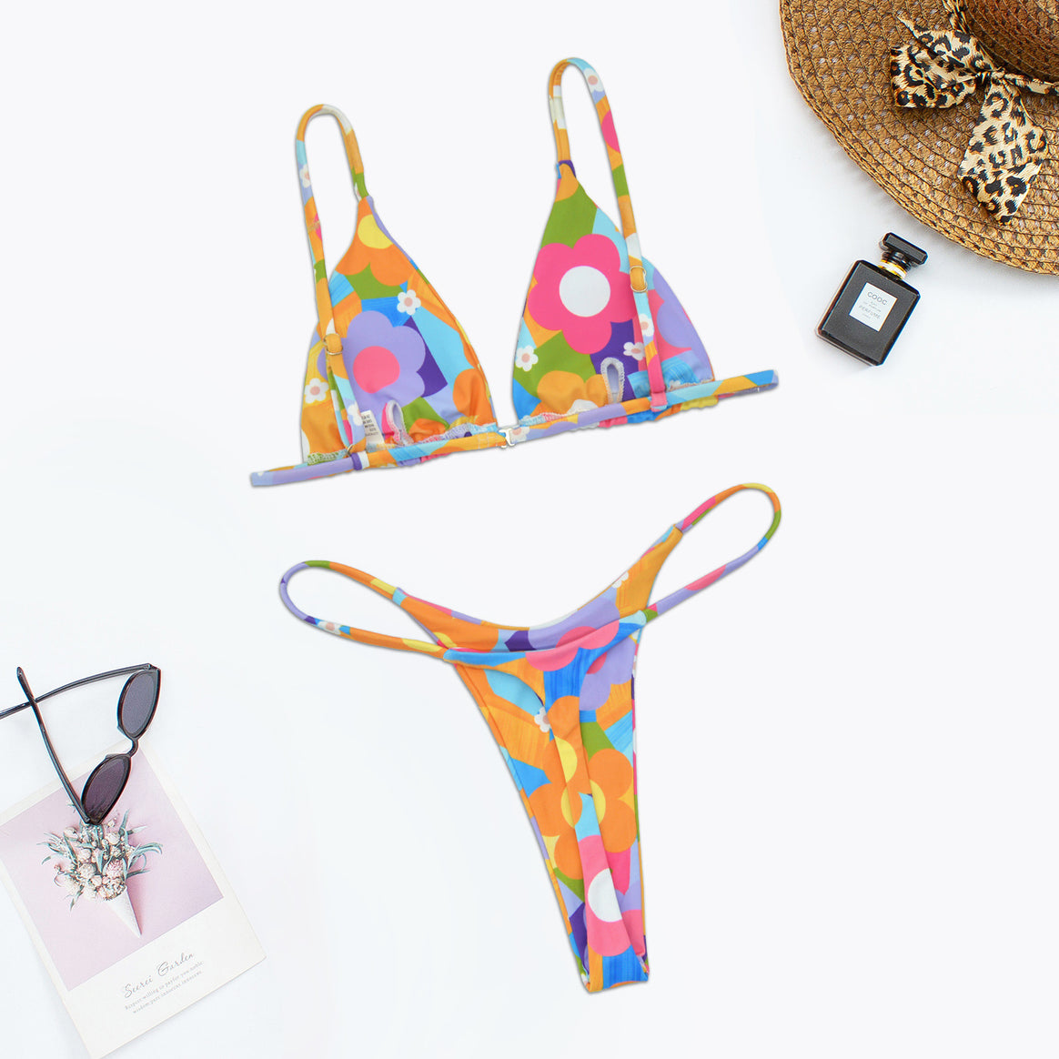 Women's triangle bikini with colorful floral design and elegant chain details Mune Fashion