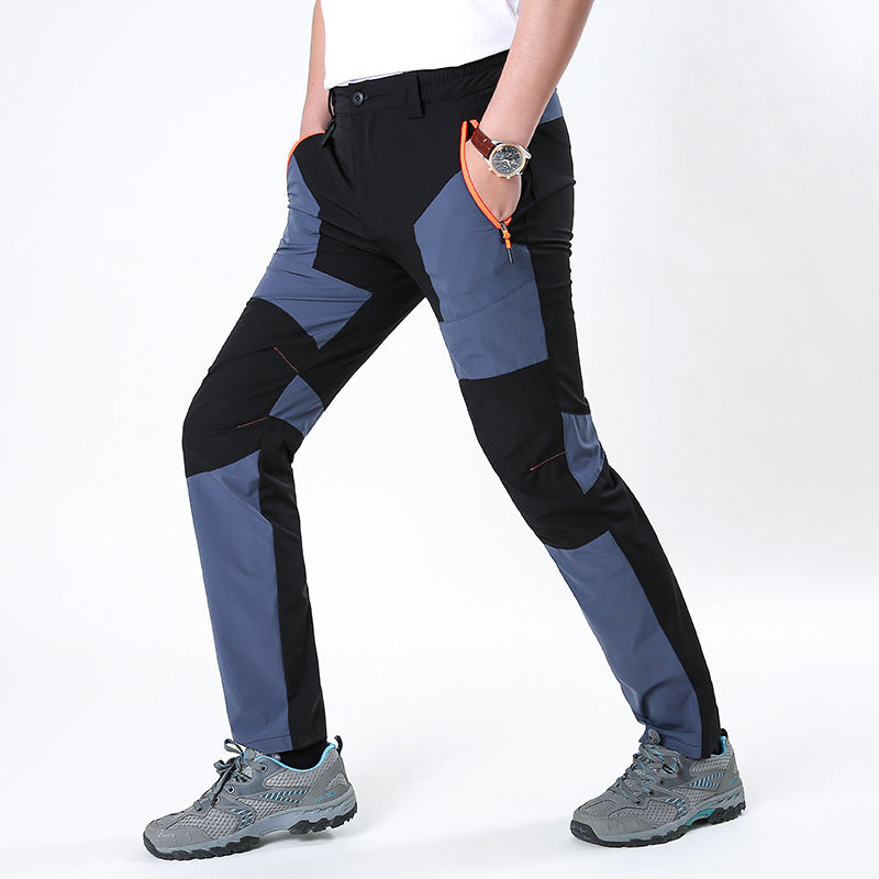 Men's functional trekking pants with reinforced knees, elastic waistband, and zipper pockets.