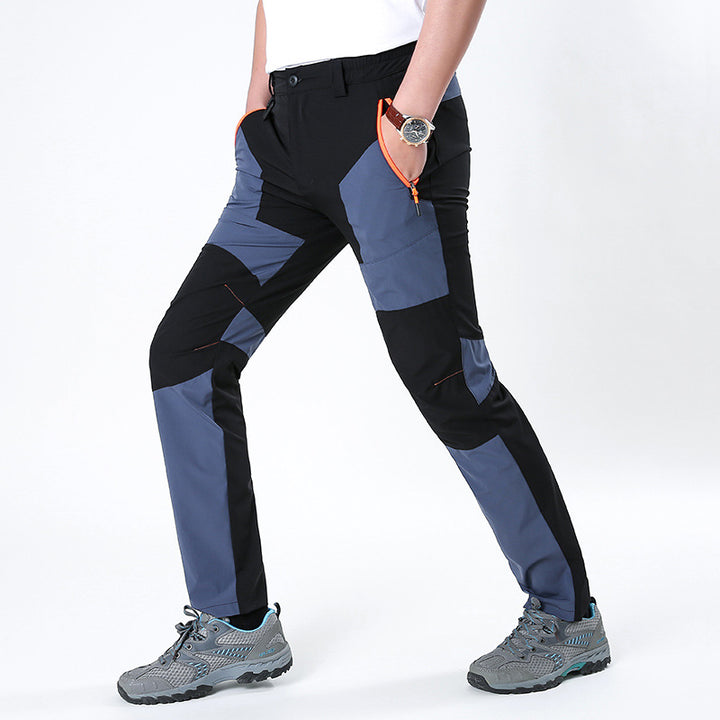 Men's functional trekking pants with reinforced knees, elastic waistband, and zipper pockets.
