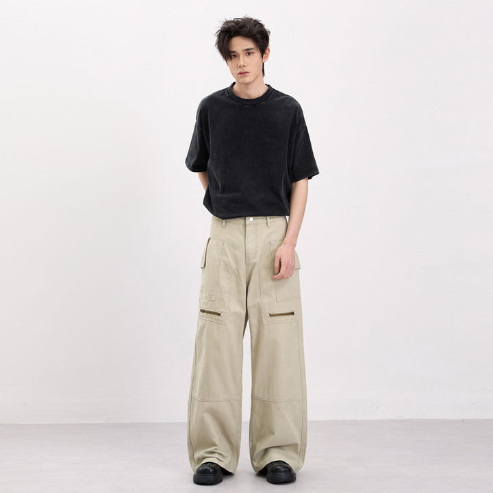 Men's baggy cargo pants in workwear style with large patch pockets and zipper details Mune Fashion