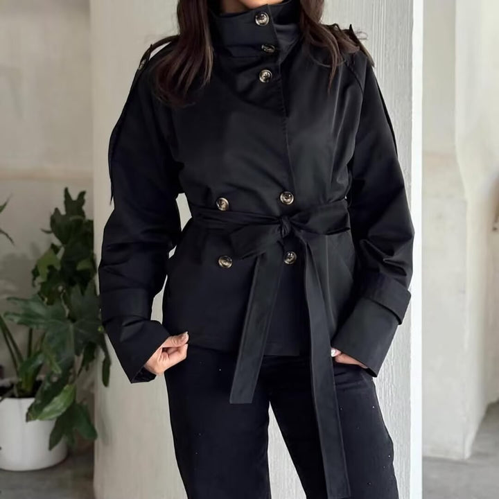 Ladies short jacket in navy-inspired double-breasted design with stand-up collar, decorative buttons, and tie belt Mune Fashion