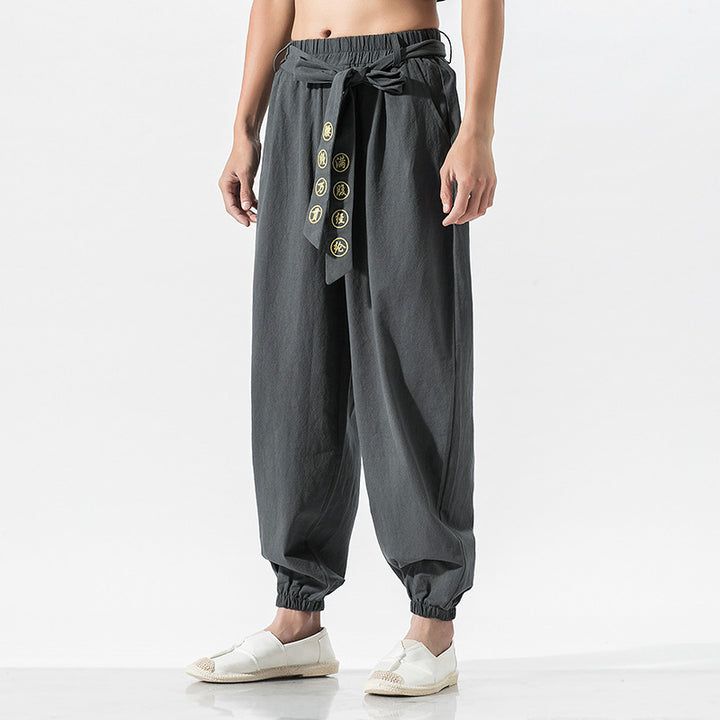 Women's wide linen trousers with drawstring waistband, binding detail, and elastic ankle cuffs Mune Fashion