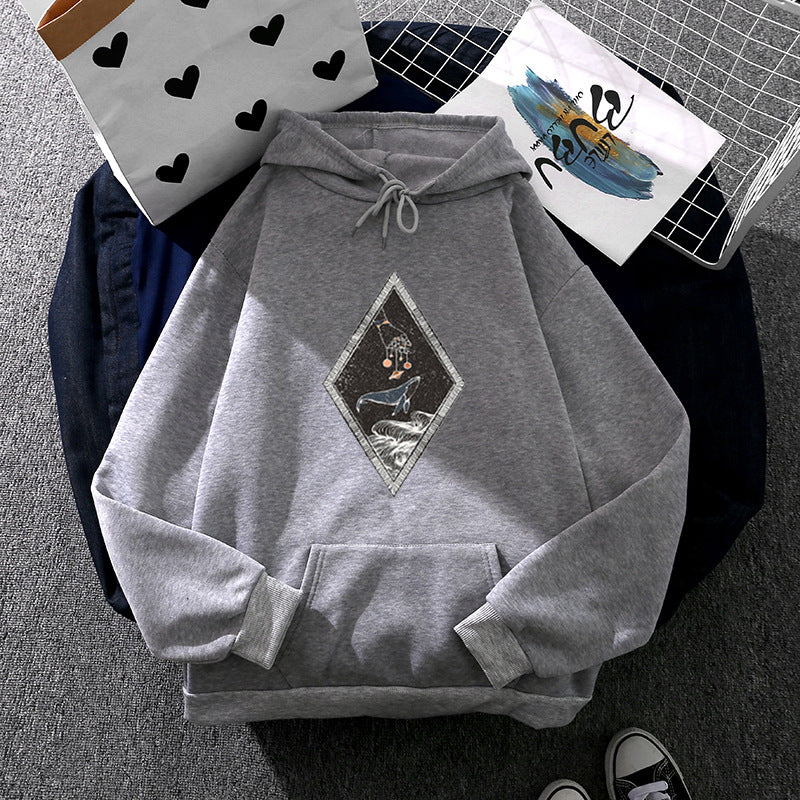 Women's oversized hoodie with sewn whale patch application, kangaroo pocket, and fleece-lined interior Mune Fashion