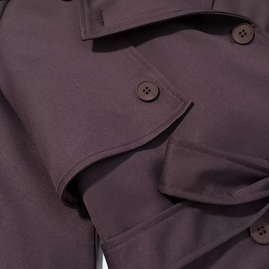 Women's longer double-breasted trench coat with waist belt, epaulettes, and storm flap Mune Fashion
