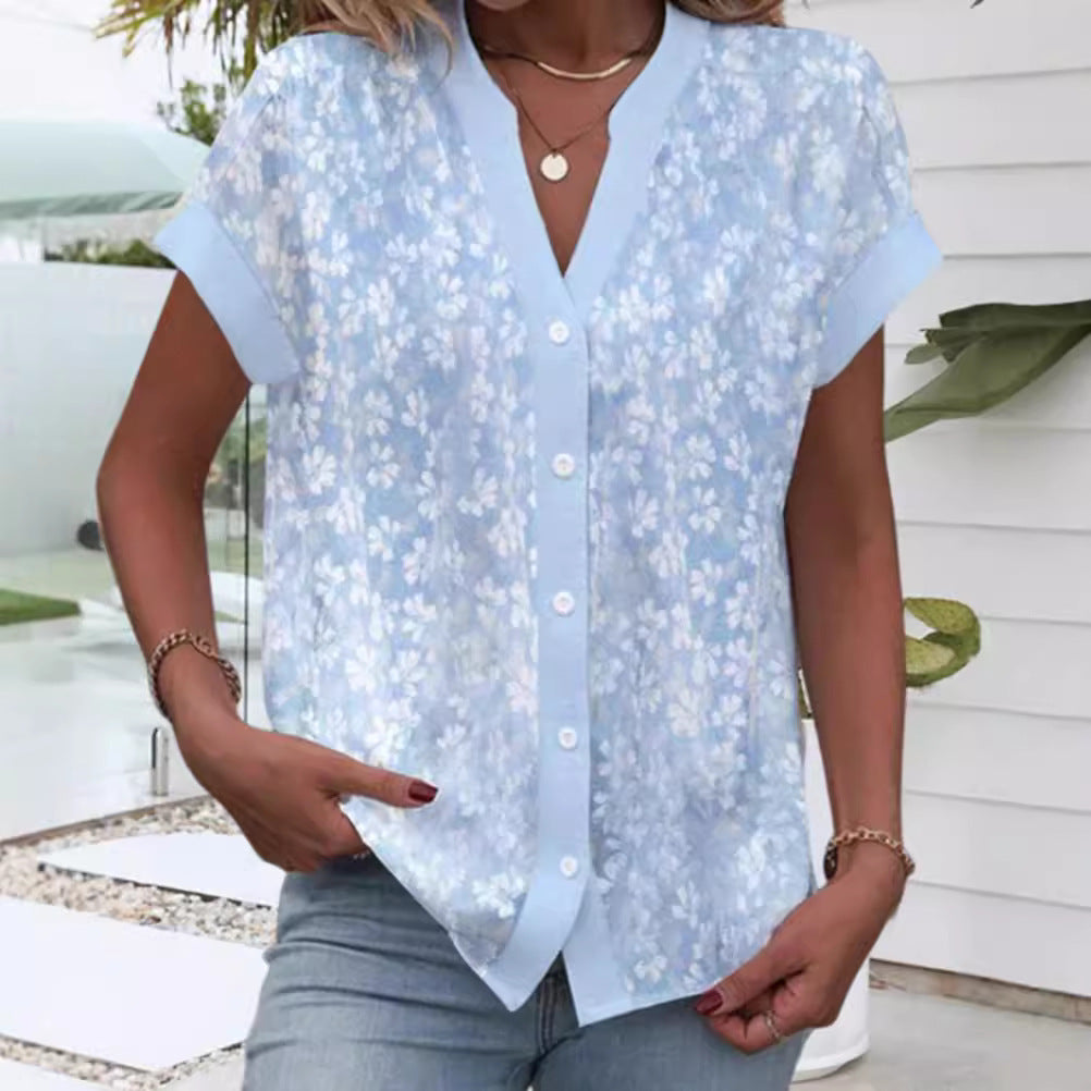 Women's airy button blouse with V-neck, rolled sleeves and floral textured print Mune Fashion
