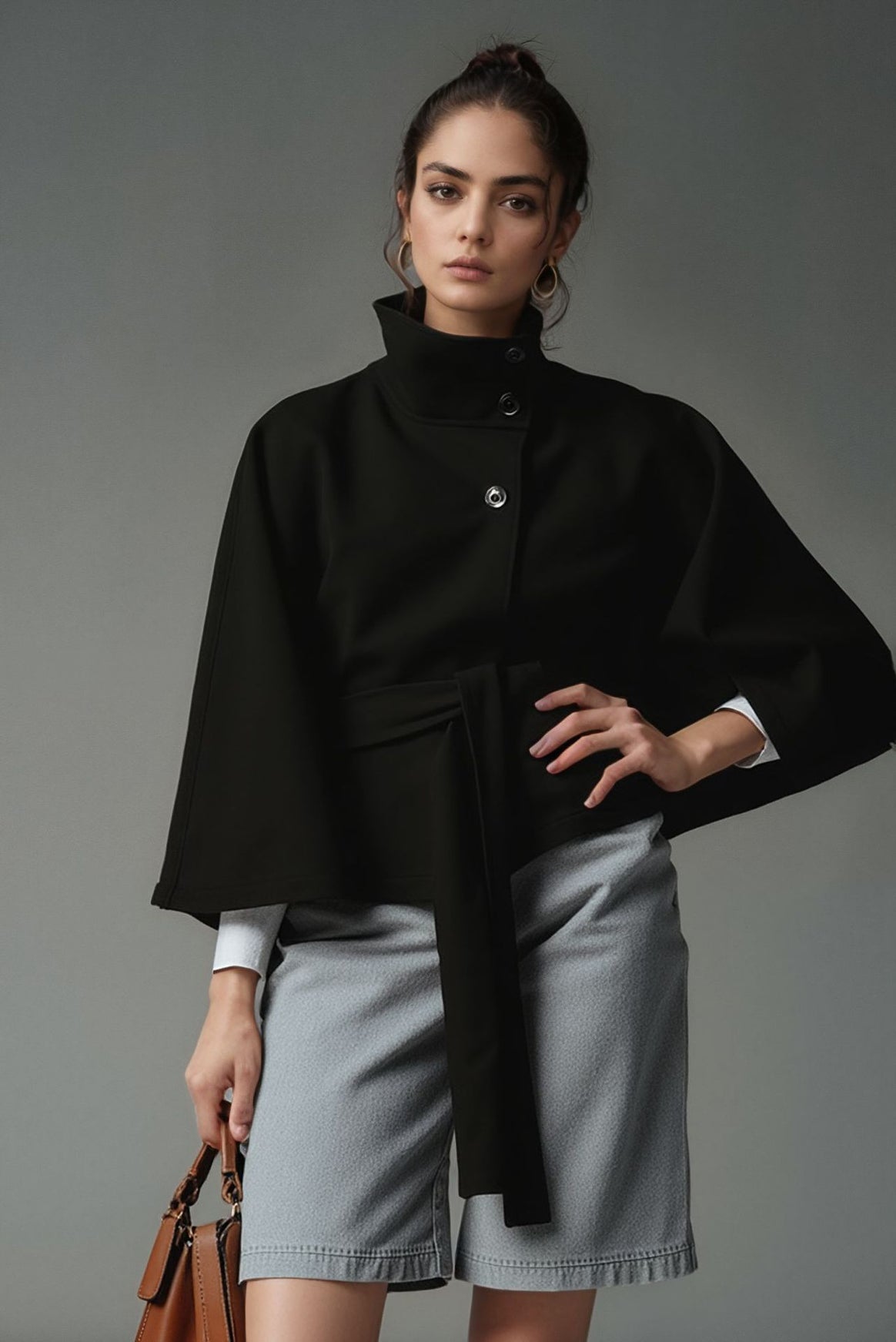 Women's short cape jacket with high stand-up collar, tie belt and boxy silhouette Mune Fashion
