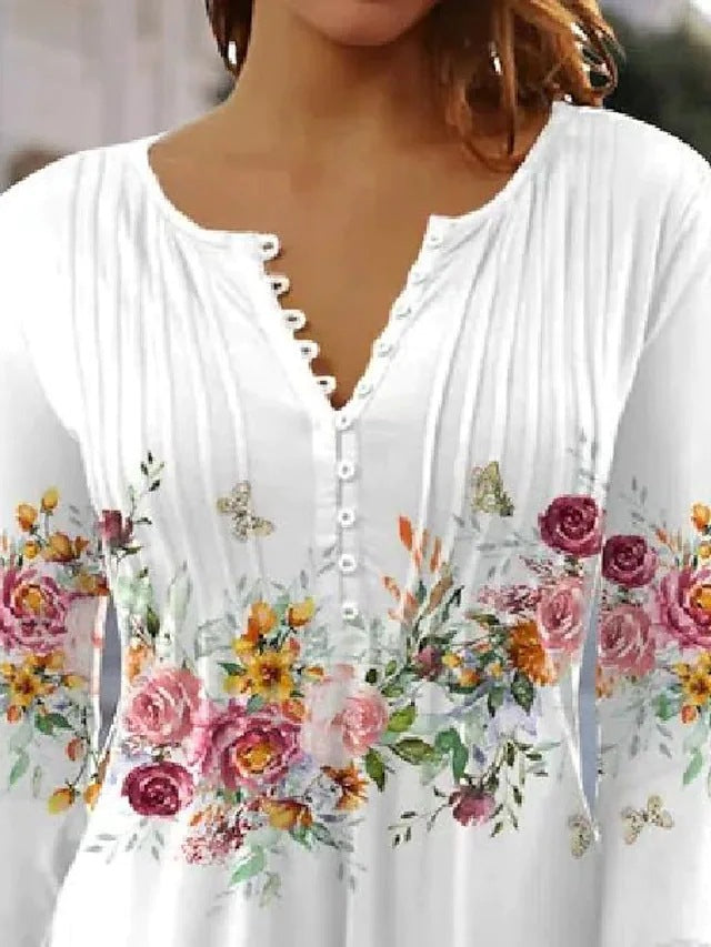 Ladies airy tunic blouse with watercolor floral border, knife pleats, and three-quarter sleeves Mune Fashion