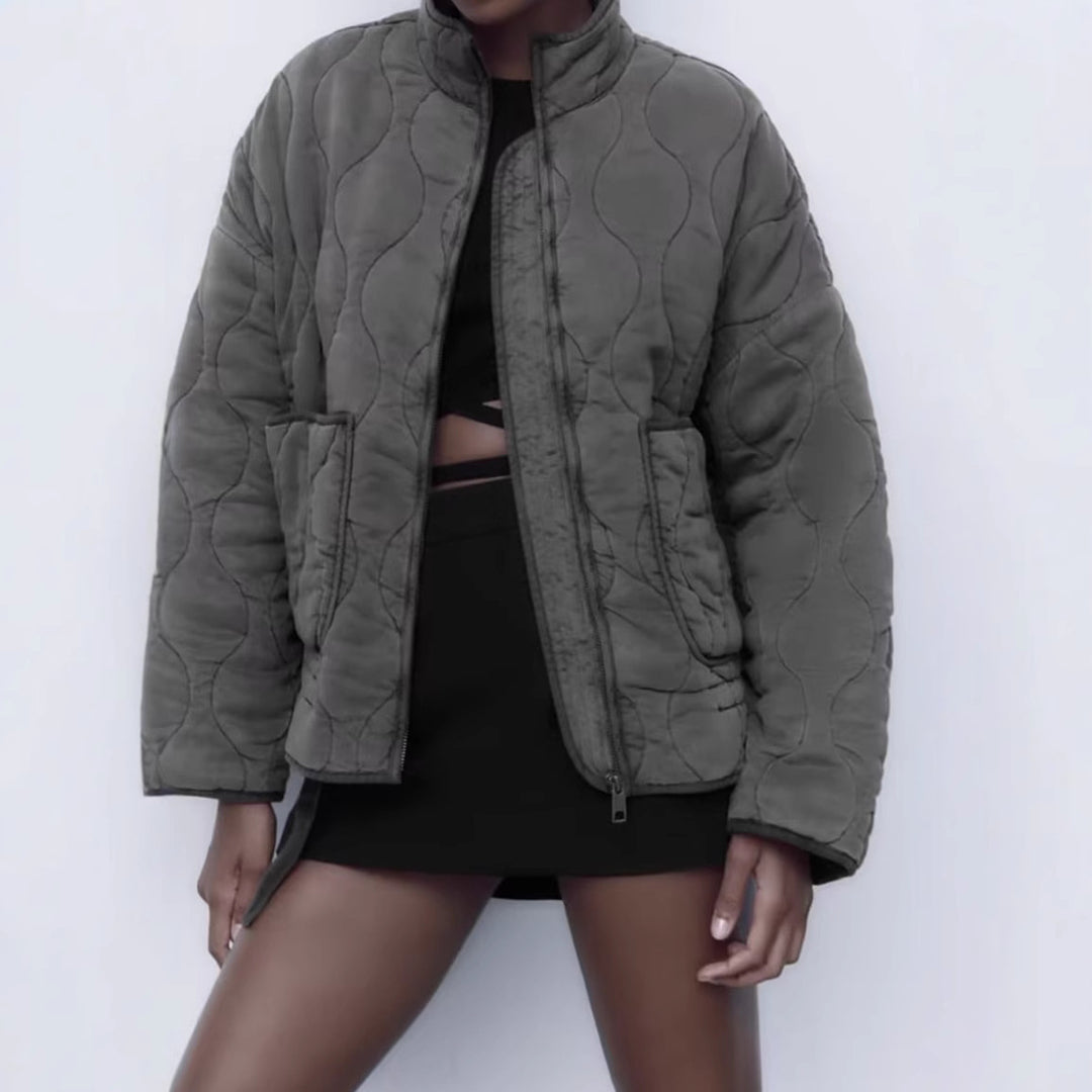 Unisex quilted jacket with stand-up collar, front pockets, and drawstring Mune Fashion