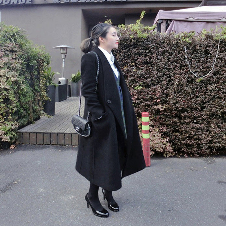 Women's midi-length tailored wool blend long coat with shawl collar, inset pockets, and discreet decorative buttons Mune Fashion