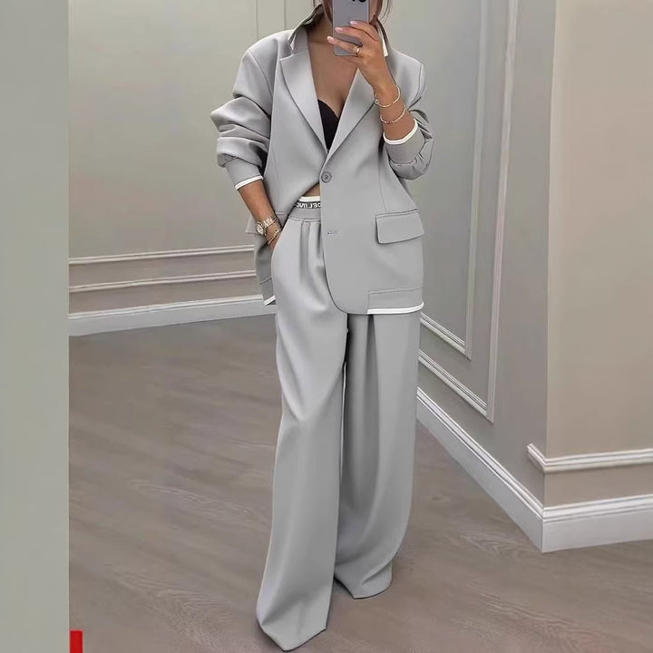 Women Oversize Tailoring Set with contrast piping, single-button blazer and high-cut wide-leg pants Mune Fashion