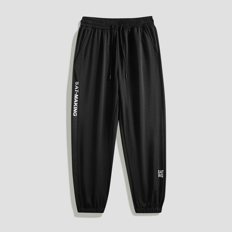 Men's sporty jogging pants with elastic waistband and zippered pockets Mune Fashion
