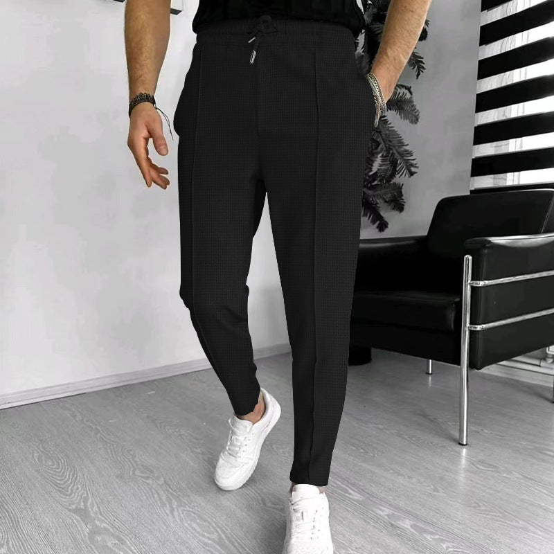 Men's tapered jogging chinos made of structured woven quality with elastic drawstring waistband and decorative crease Mune Fashion