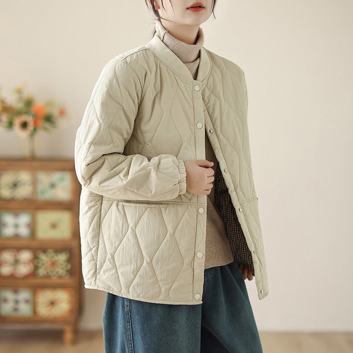 Women's lightweight padded transitional jacket with oversized cut, elastic sleeve cuffs and concealed snap button placket Mune Fashion