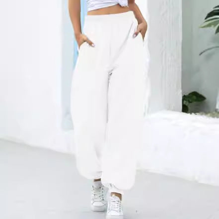 Women's wide High-Waist jogging pants made of soft fleece with elastic waistband, side pockets, and narrow cuffs Mune Fashion