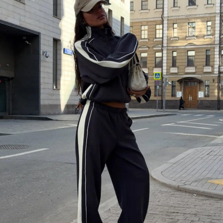 Women's oversized tracksuit with zip jacket, wide joggers, and contrast side stripes Mune Fashion
