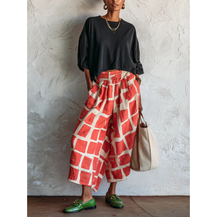 Women's patterned culotte palazzo pants with wide legs, elastic waistband, and side pockets